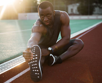Athlete Stretching Legs