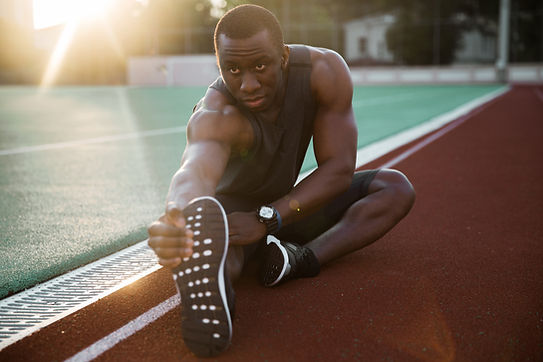 Athlete Stretching Legs