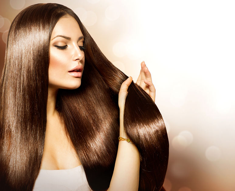 Hair. Beauty Fashion Model Woman touching her Long and Healthy Brown Hair. Beauty Brunette