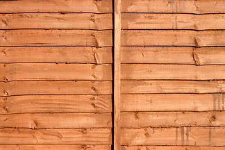 Stained wood garden fence background