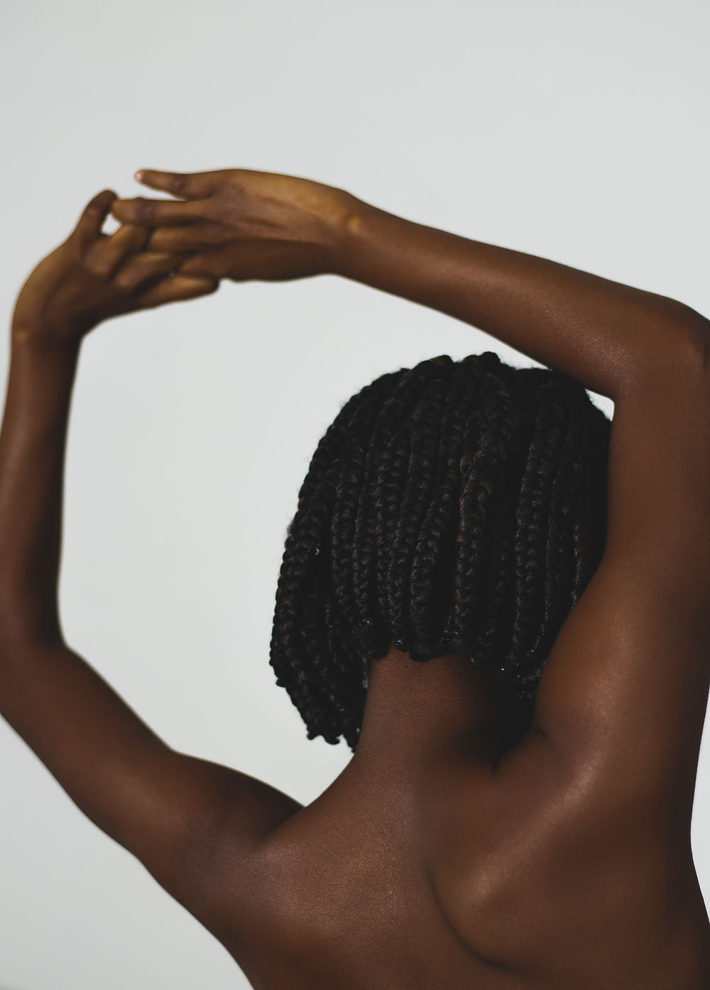 Woman stretching arms above her head