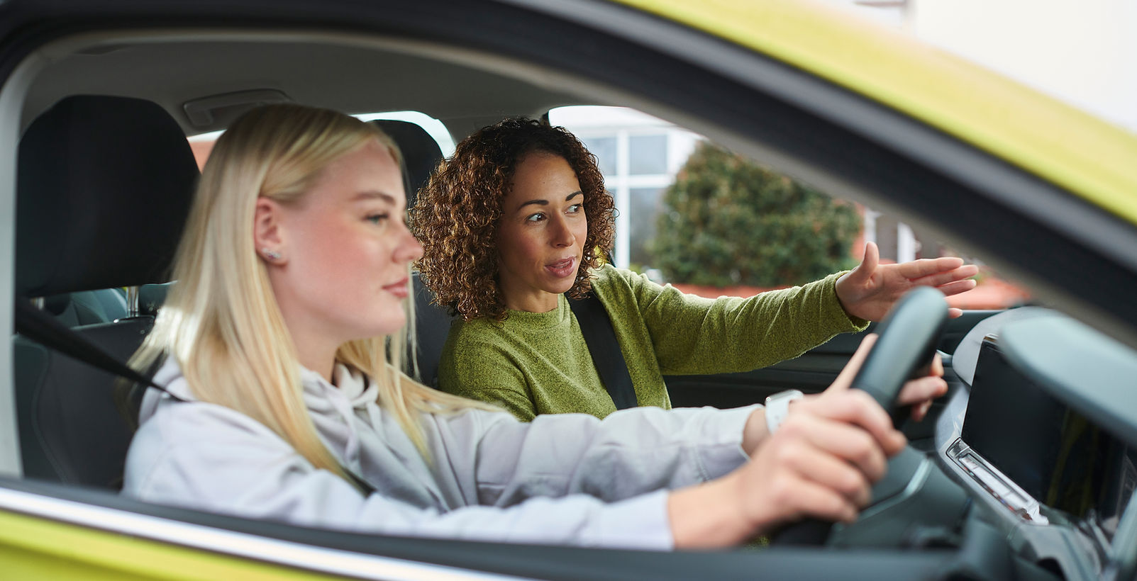 Driving lesson with instructor and learner