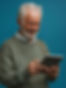 Elderly man using tablet