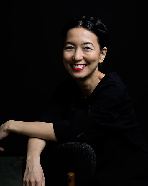 A woman smiling with pretty makeup