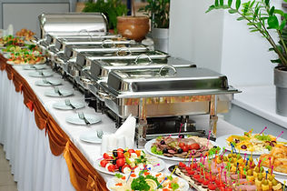 Banquet table with chafing dish heaters and canapes