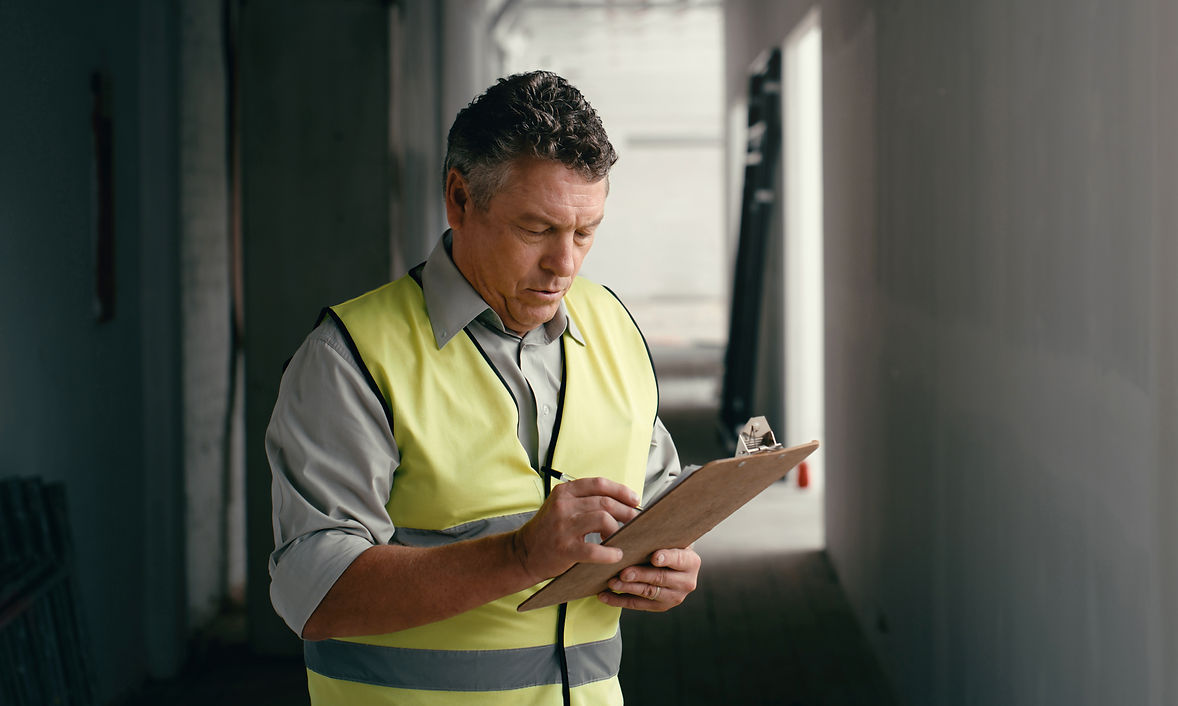 Building contractor inspecting a property