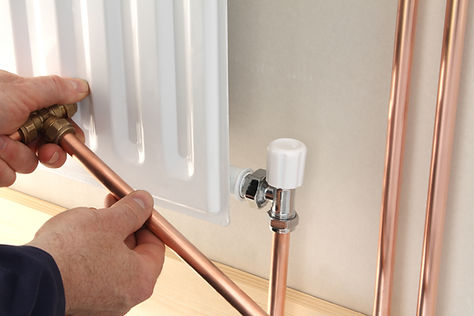 A plumber installing central heating