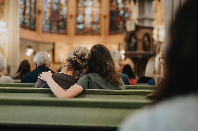 Comforting Embrace in Church Pew