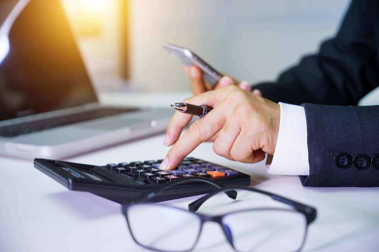 Male accountant or banker making calculations