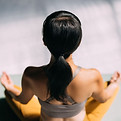Woman Practicing Yoga-flamekeeper