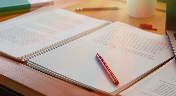A pen on a pile of documents