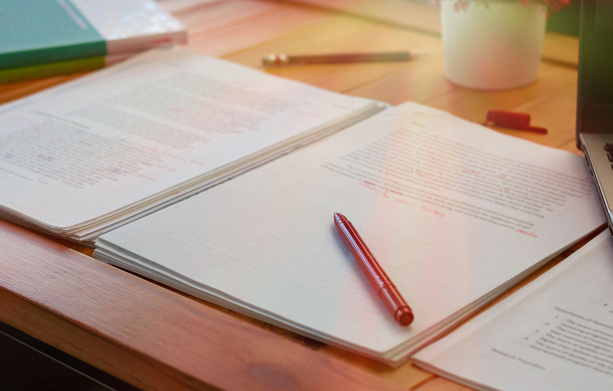 A pen on a pile of documents