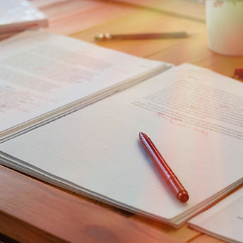 A pen on a pile of documents