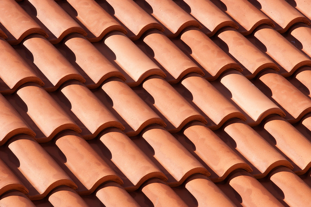 Close-up of a red clay roof, showcasing its texture