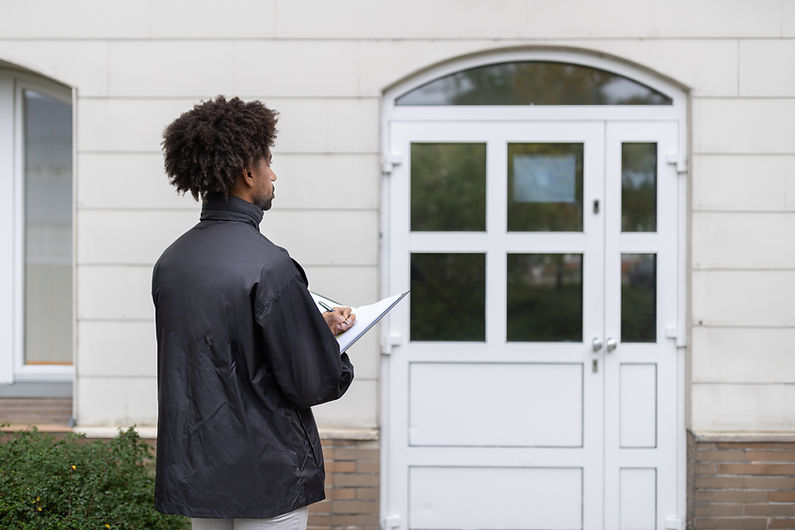 Man Inspecting Entrance