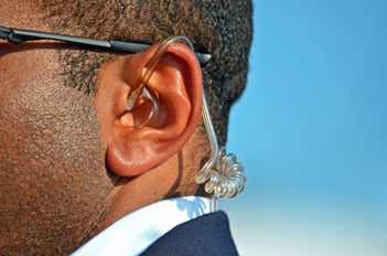 earpiece in a Secret Service agent's ear