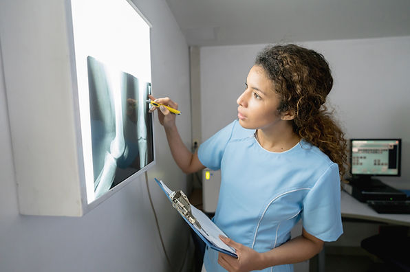 Nurse Examining X-Ray