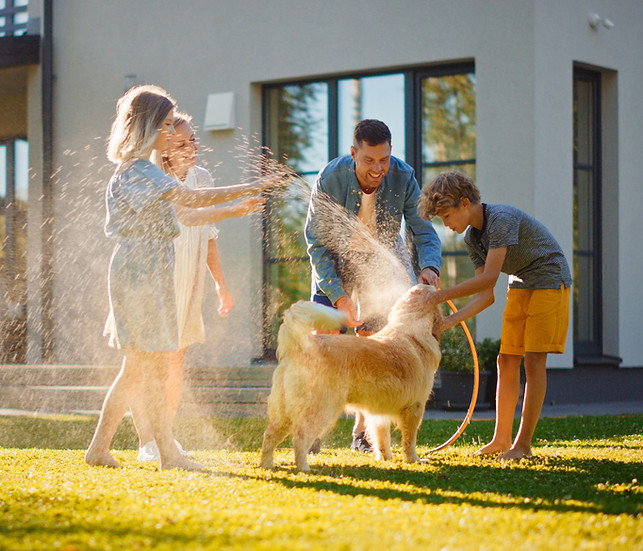 Family Washing Dog