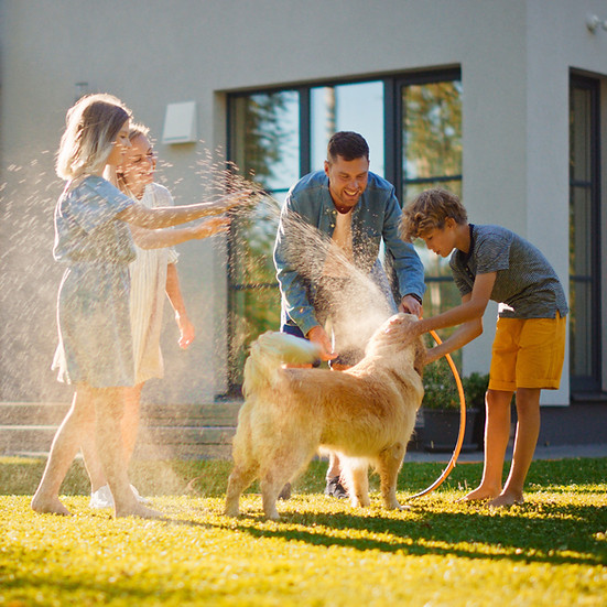 Family Washing Dog