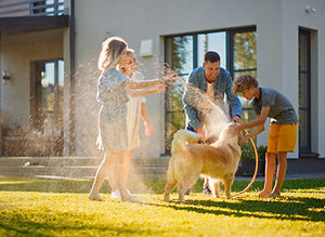 Family Washing Dog
