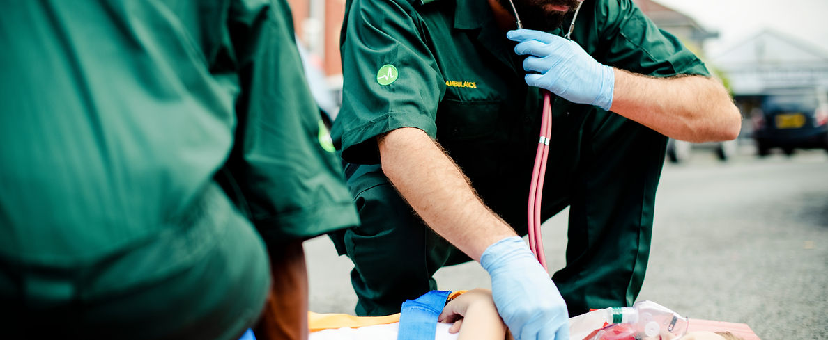 Paramedics Assisting Patient