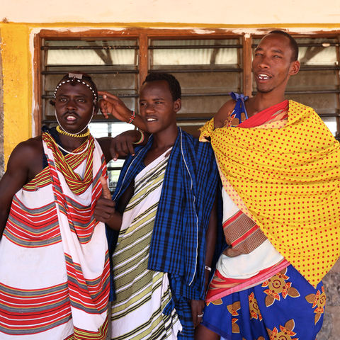 Three men in traditional attire.