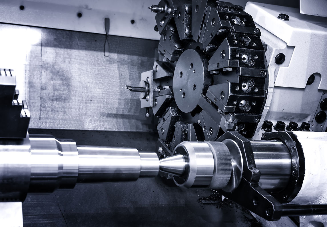 CNC machine lathe, featuring a rotating metal part in a sleek