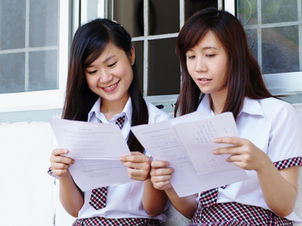 Two women comparing notes