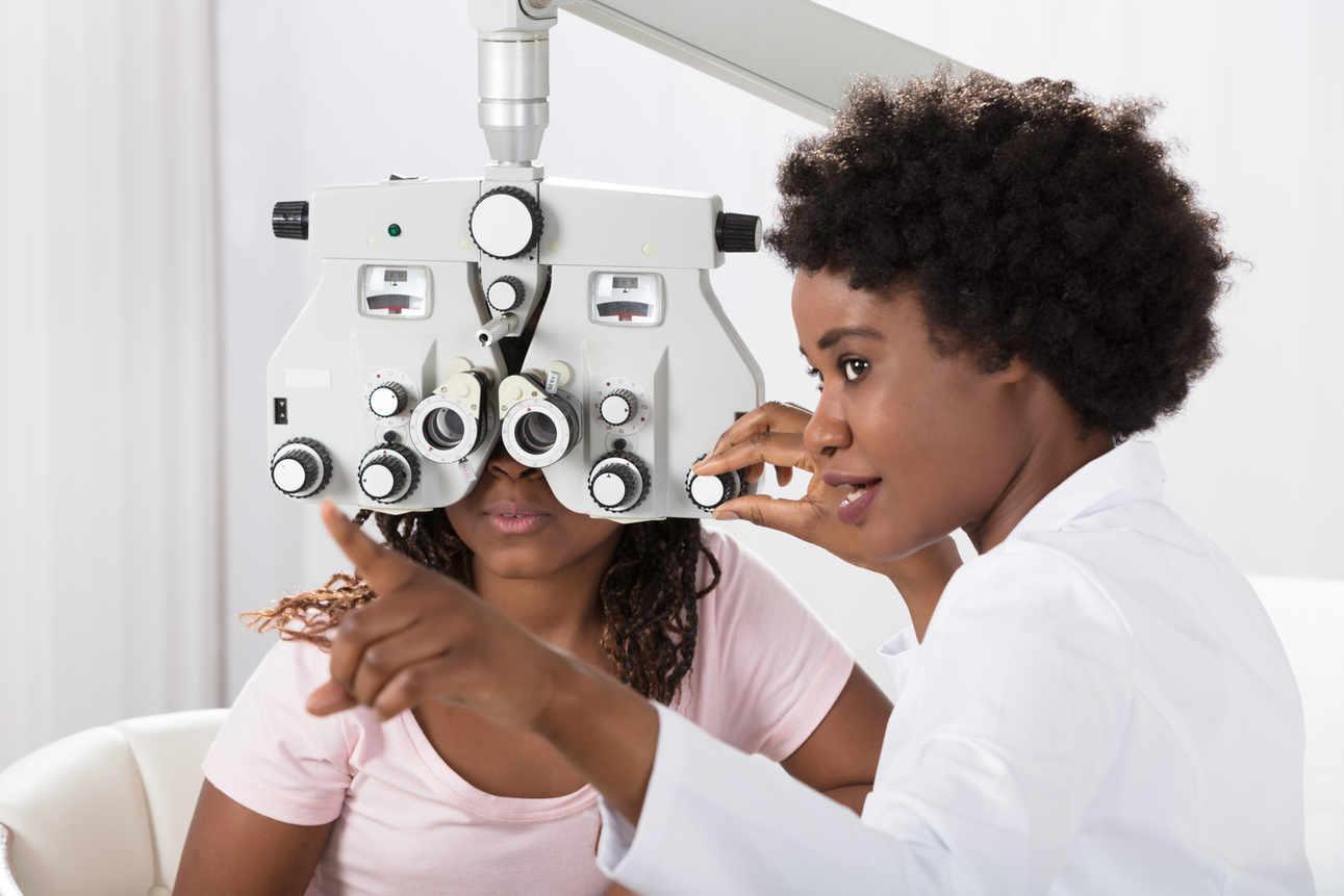 Optician and client during Vision exam