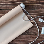Beige shutters placed on an old wooden table