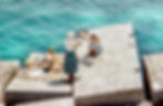Women relaxing by the ocean
