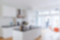 Kitchen with counter island and table in modern building