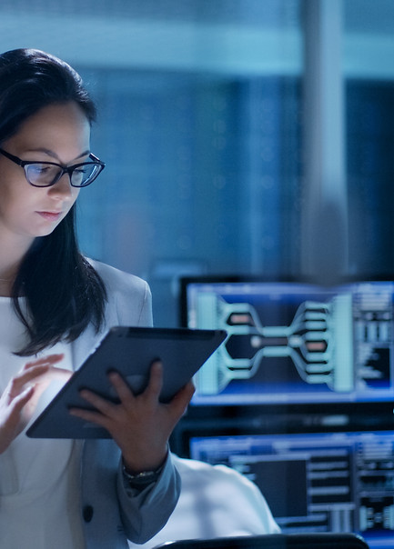 Young Female Government Employee Wearing Glasses Uses Tablet in System Control Center. In 