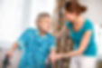 Senior woman with her caregiver at home