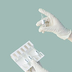 Hands Holding Vials