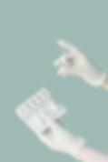 Hands Holding Vials