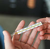 Holding Thermometer
