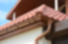 Roof with brown tiles and gutter