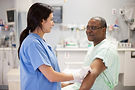Nurse Assisting Patient