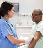 Nurse Assisting Patient