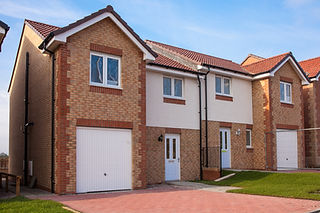 Modern brick residential house with freshly cleaned render walls