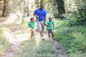A father and children hiking