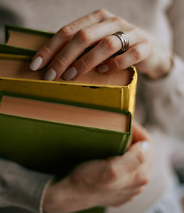 Hands Holding Books