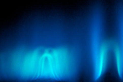 An abstract shot of the blue flame of a gas heater