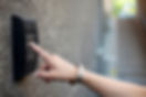 Person entering code at door entry codelock