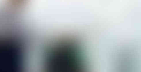 A forklift lifting a container