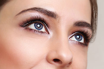 Beautiful blue woman eyes with long lashes looking