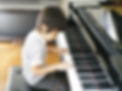 Young Boy Playing the Piano