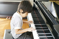 Young Boy Playing the Piano