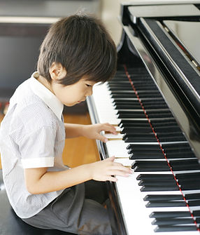 Young Boy Playing the Piano